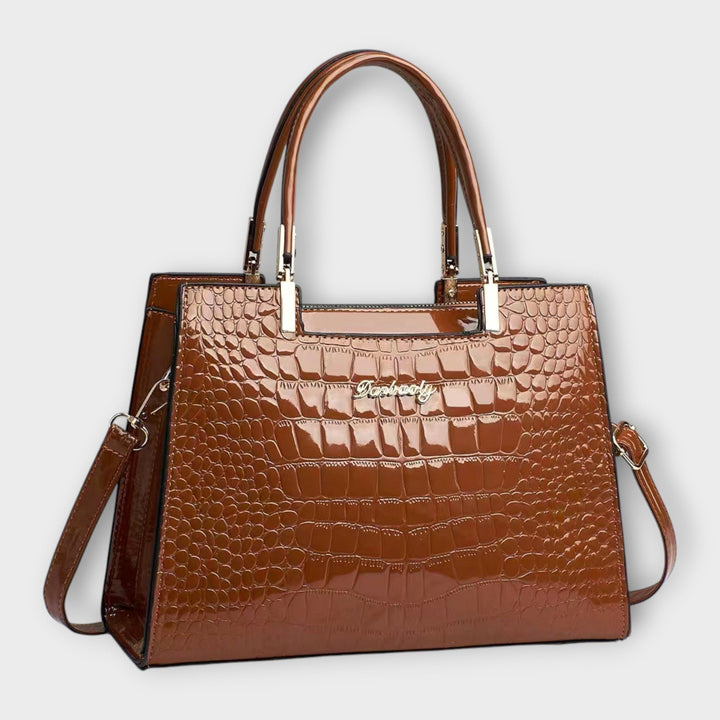 Lora. - Glänzende Krokodilledermuster-Handtasche