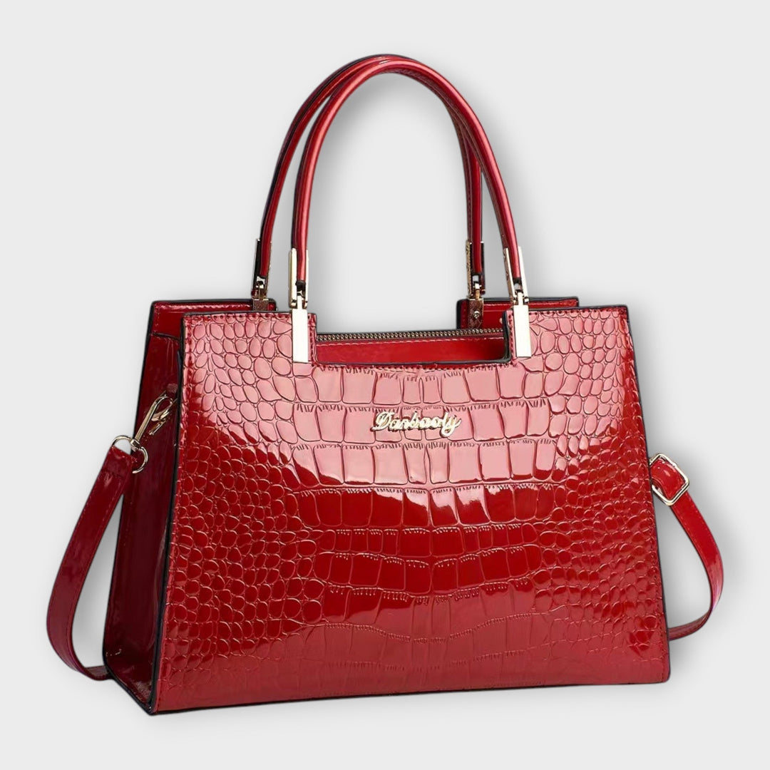 Lora. - Glänzende Krokodilledermuster-Handtasche
