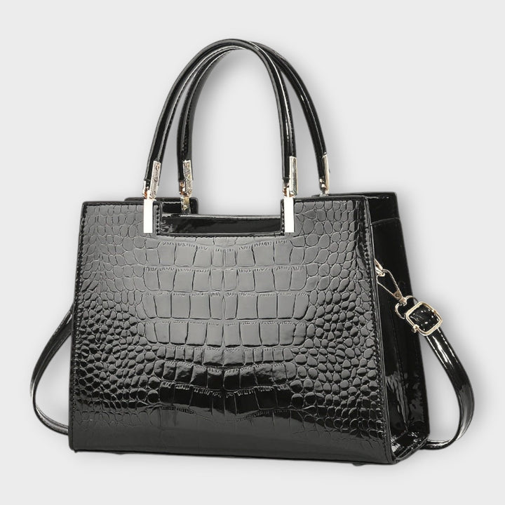 Lora. - Glänzende Krokodilledermuster-Handtasche
