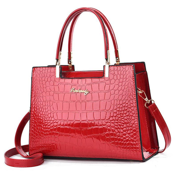Lora. - Glänzende Krokodilledermuster-Handtasche